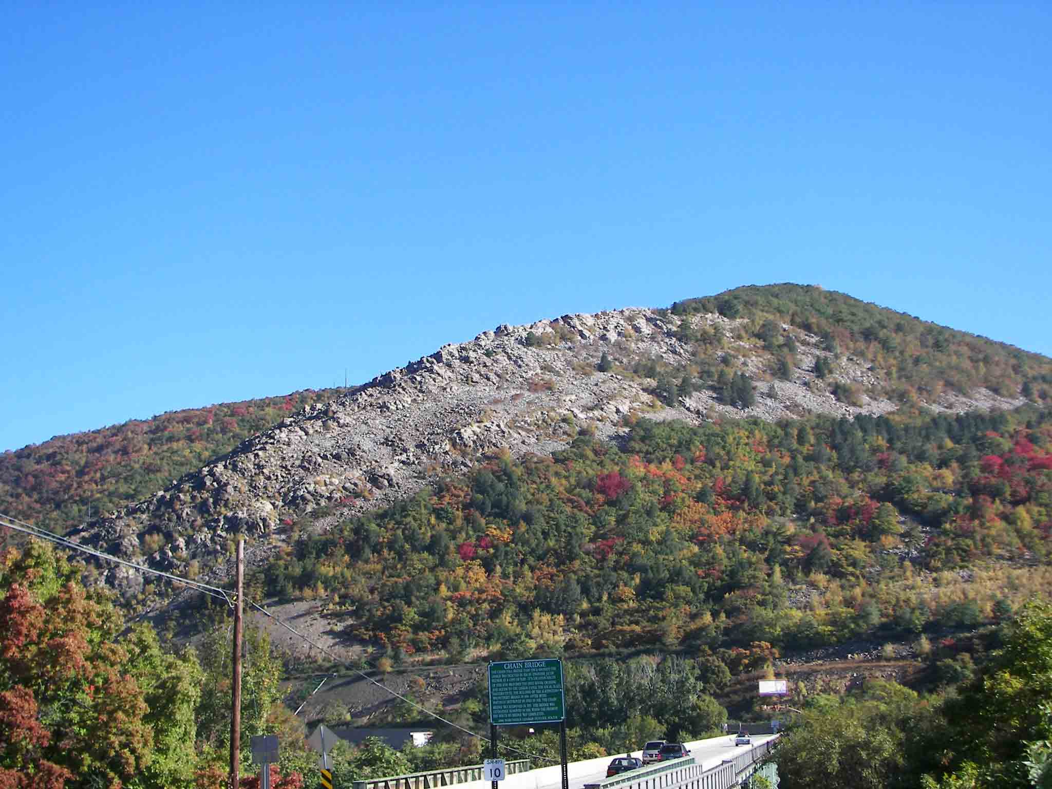 mm 20.7 The northbound trail crosses the PA 873 bridge and climbs the
 ridge in the background.   Courtesy jadams444@aol.com